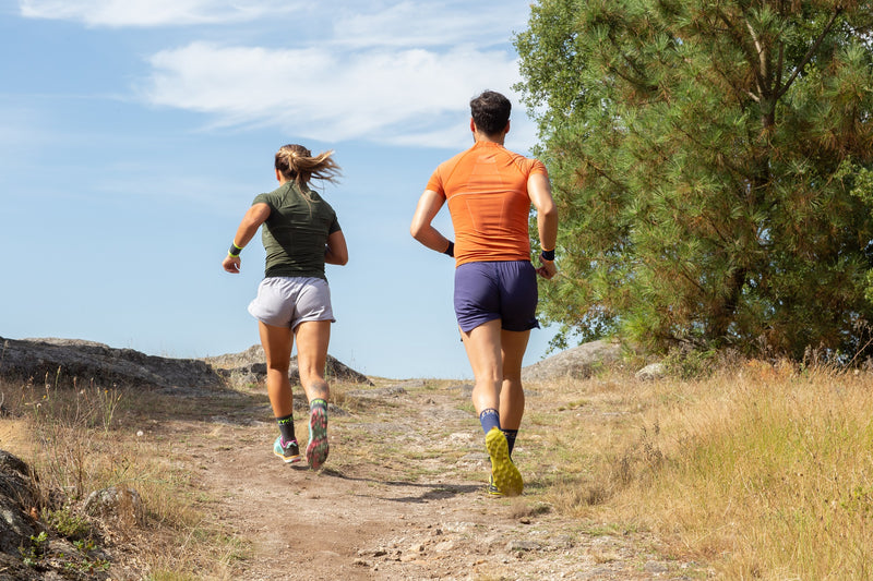 Men and women trail running in their seamless clothing