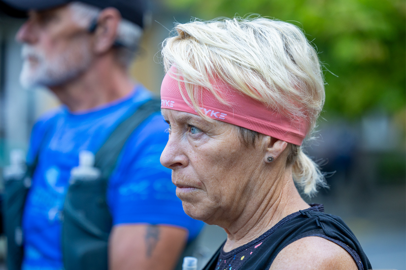 Woman wearing a coral running headband