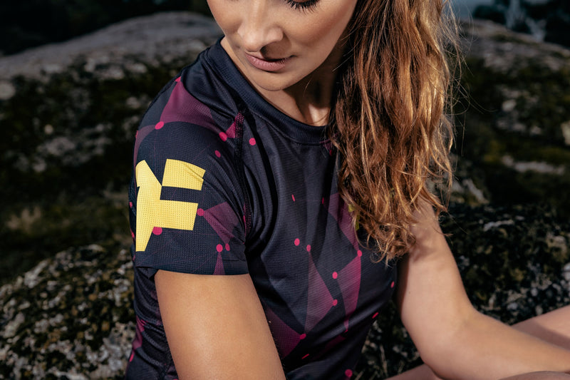 Woman wearing a Petrol T-shirt from an elite sportswear brand: Fyke