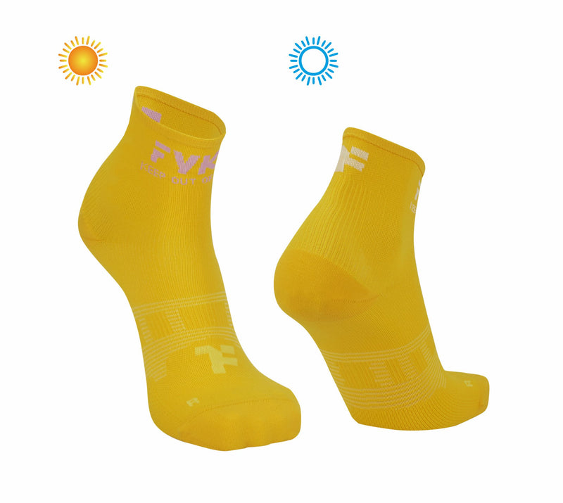 Boost Socks Low: Yellow Sun Socks that change the color of the fyke logo with exposure to the sun.